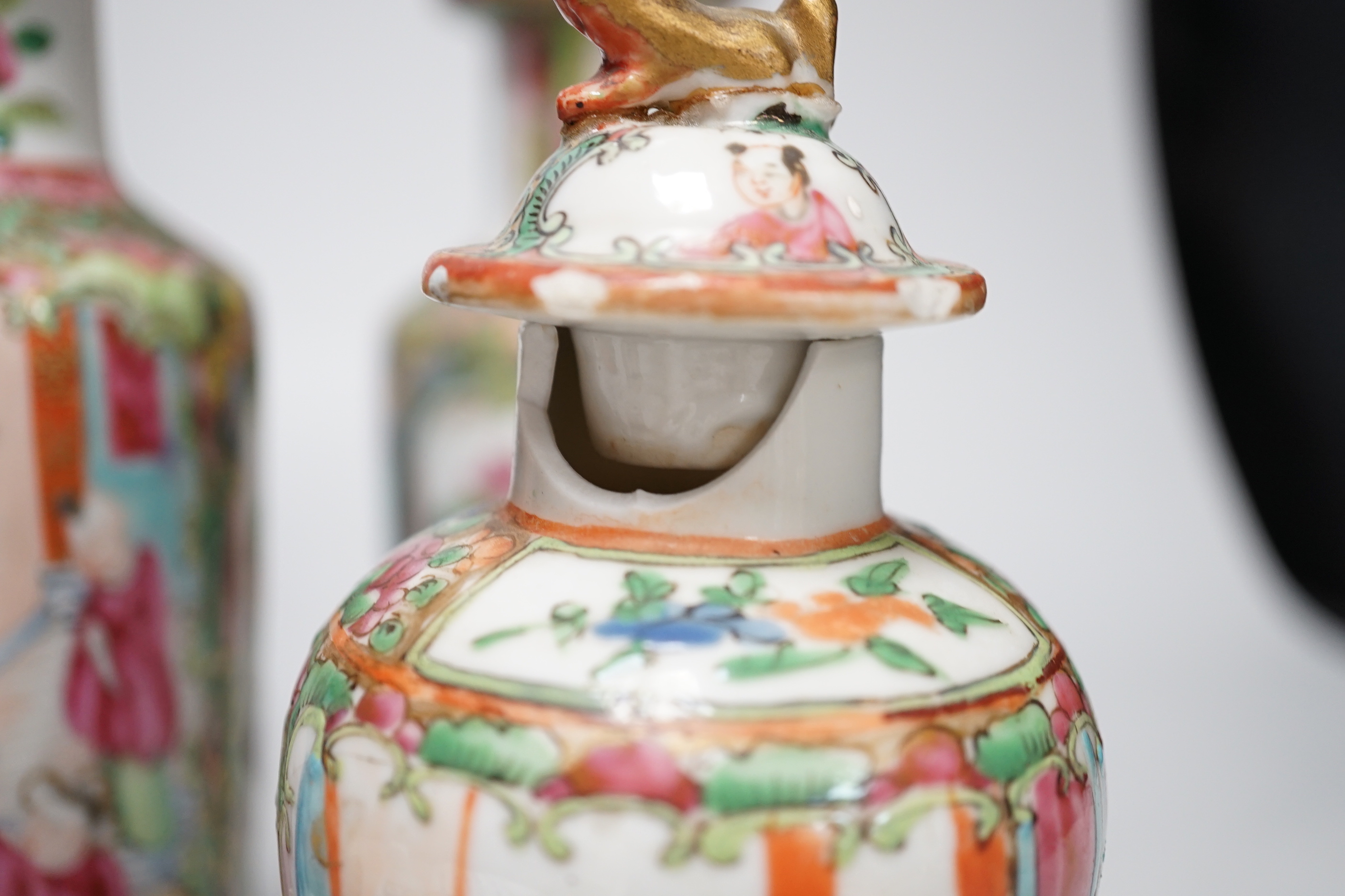 Chinese ceramics including a pair of Canton vases, baluster jar and cover and enamelled matchbox holder, the largest 24cm high